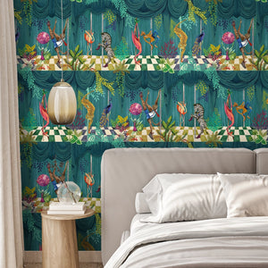 Creature Club wallpaper by Brand McKenzie in green, animals on a checkerboard stage behind a bed