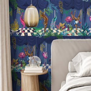 Creature Club wallpaper by Brand McKenzie in blue, animals on a checkerboard stage behind a bed