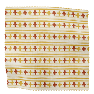 Cross Stitch linen by Annika Reed in orange and red, draped, showing cross-stitch motifs