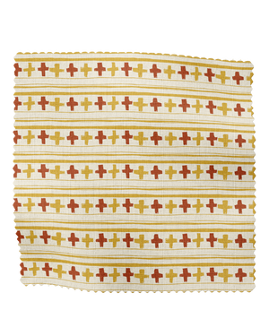 Cross Stitch linen by Annika Reed in orange and red, draped, showing cross-stitch motifs