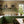 Cross Stitch wallpaper by Annika Reed in orange and red, cross-stitch motifs in a kitchen