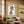 Cross Stitch wallpaper by Annika Reed in orange and red, cross-stitch motifs in a living room