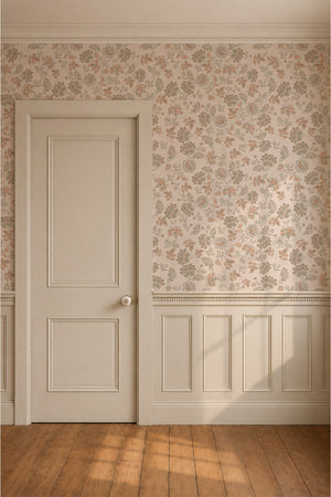 Amelie wallpaper by Curate Space in blossom pink, vintage chintz florals in a hallway with a white panelled door