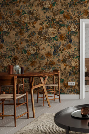 Bridie wallpaper by Curate Space in warm autumn orange, oversized painterly blooms in a dining room with wooden chairs and a table