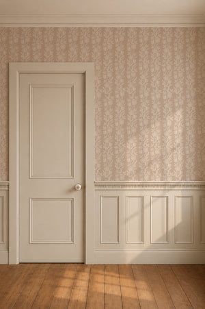 Dilys wallpaper by Curate Space in plaster beige, a floral stripe in a hallway with a white panelled door