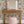 Freya wallpaper by Curate Space in off-white, loose painterly flowers and leaves behind a dressing table with a pink stool