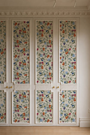 Freya wallpaper by Curate Space in off-white, loose painterly flowers and leaves in a room with built-in cupboards