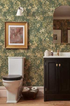 Iris wallpaper by Curate Space in soft green, botanical blooms and foliage in a bathroom with a dark vanity