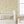 Jude wallpaper by Curate Space in butter yellow, insects on a soft check in a nursery with a white cot