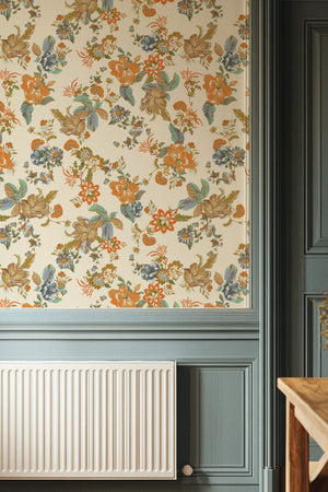 Lottie wallpaper by Curate Space in off-white, oversized chintz-style florals in a hallway with blue-grey panelling and a radiator