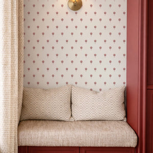 Madeline wallpaper by Curate Space in indigo, a small dotted print in a window seat with red panelling