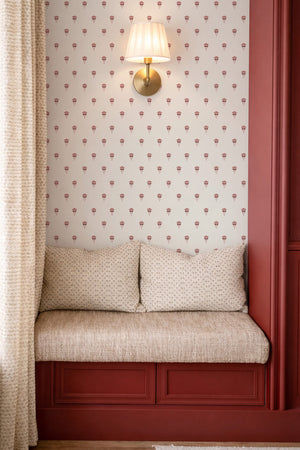 Madeline wallpaper by Curate Space in indigo, a small dotted print in a window seat with red panelling