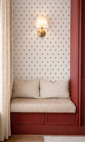 Madeline wallpaper by Curate Space in red, fan-shaped floral motifs in a bedroom alcove