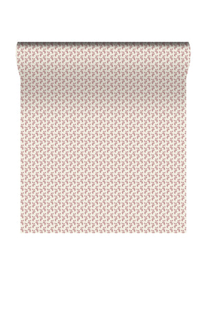 Maeva wallpaper by Curate Space in rouge red, rolled length showing a small trailing vine