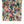 Margot wallpaper by Curate Space in green, rolled length showing painterly roses and wildflowers