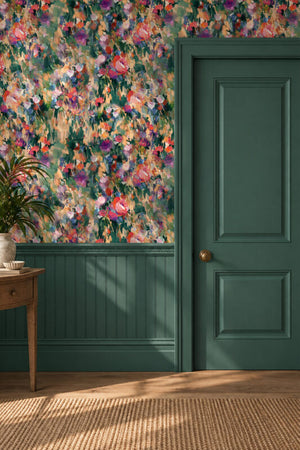 Margot wallpaper by Curate Space in green, painterly roses and wildflowers in a hallway above green panelling