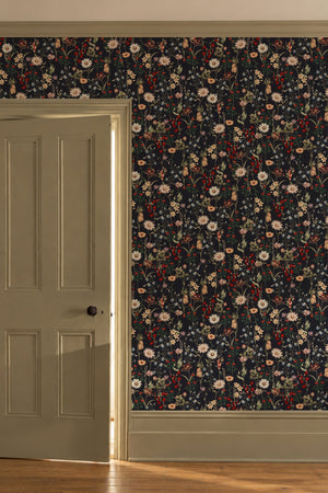 Nola wallpaper by Curate Space in midnight blue, wildflowers and tall stems in a hallway beside a panelled door