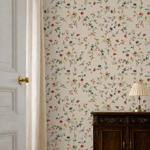 Paloma Curate Space wallpaper in off-white, trailing floral stems in a hallway doorway beside a dark cabinet