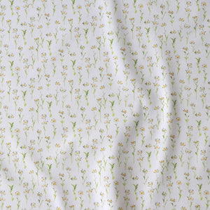 Betsy Flora linen by Seed Home Designs in yellow and green, flat sample of delicate ditsy flowers