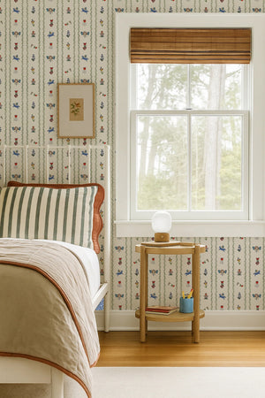 Dance Away With the Fairies wallpaper by Annika Reed in cream and green, fairies in rows behind a bed