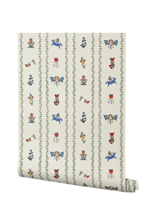 Dance Away With the Fairies wallpaper by Annika Reed in cream and green, partly unrolled roll showing fairies in rows