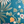 Eden wallpaper by Deus ex Gardenia in teal, detail of lush leaves and fruit