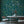 Eden wallpaper by Deus ex Gardenia in teal, lush leaves and fruit in a dining area