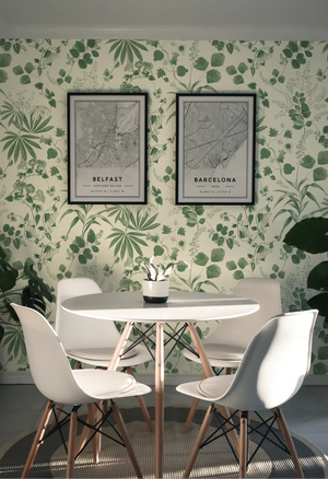 Eden wallpaper by Deus ex Gardenia in cream and green, lush leaves and fruit behind a dining table