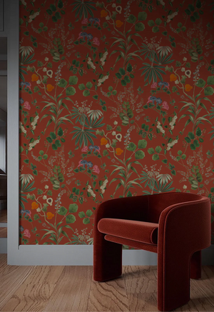 Eden wallpaper by Deus ex Gardenia in orange, lush leaves and fruit in a living room