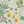 Eden wallpaper by Deus ex Gardenia in cream and green, full repeat of lush leaves and fruit (alternate view)