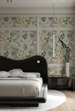 Eden wallpaper by Deus ex Gardenia in cream and green, lush leaves and fruit behind a bed