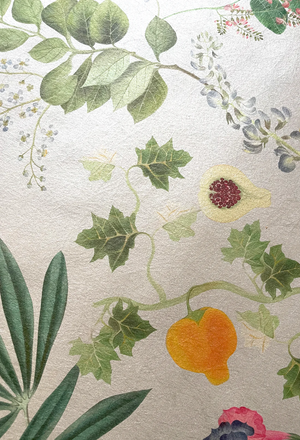 Eden wallpaper by Deus ex Gardenia in cream and green, close-up of lush leaves and fruit