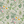 Eden wallpaper by Deus ex Gardenia in cream and green, pattern sample of lush leaves and fruit