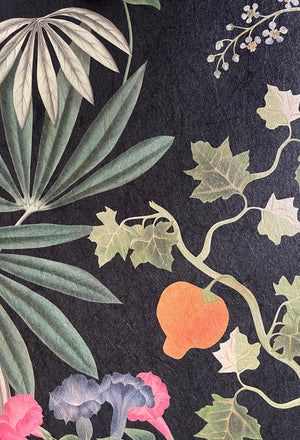 Eden wallpaper by Deus ex Gardenia in black, close-up of lush leaves and fruit