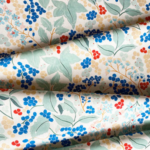 Elizabeth linen by Claire de Quénetain in green and blue, draped, showing a hand-painted floral design