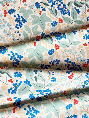 Elizabeth linen by Claire de Quénetain in green and blue, draped, showing a hand-painted floral design