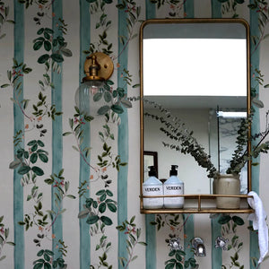 Fiorita Stripe wallpaper by Deus ex Gardenia in blue and white, floral vine stripes in a bathroom