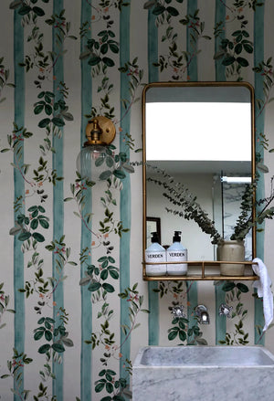 Fiorita Stripe wallpaper by Deus ex Gardenia in blue and white, floral vine stripes in a bathroom
