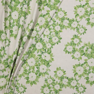 Folio linen by Bethie Tricks in green and white, draped, showing a leaf medallion print