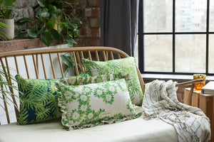 Folio linen by Bethie Tricks in green and white, a leaf medallion print made into a cushion