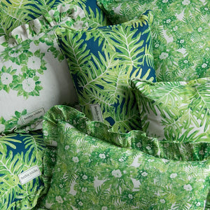 Hepta linen by Bethie Tricks in green, leafy rosettes made into a cushion