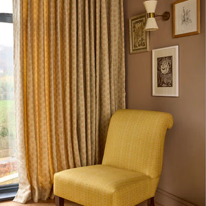 Folly linen by Parker and Jules in blue, sunburst medallions in a living room