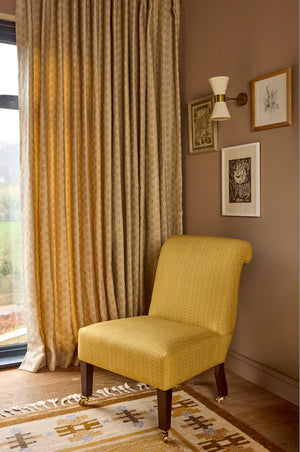 Folly linen by Parker and Jules in blue, sunburst medallions in a living room