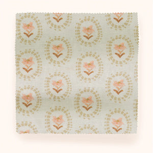 Folly linen by Parker and Jules in beige, draped close-up of sunburst medallions