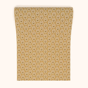 Folly wallpaper by Parker and Jules in mustard, roll showing small sunburst medallions