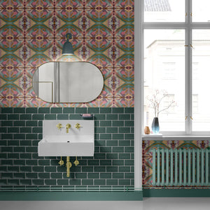 Franny wallpaper by Tatie Lou in pink and green, a kaleidoscopic floral on a bathroom wall