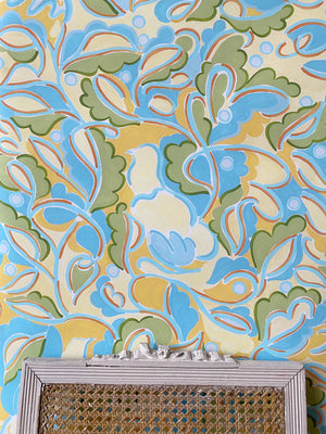 Fresh Morning wallpaper by Claire de Quénetain in yellow and blue, full repeat of a hand-painted floral design