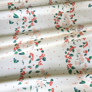Frida linen by Claire de Quénetain in cream, draped, showing a hand-painted floral design