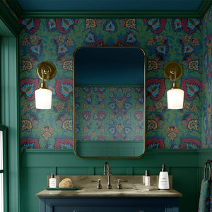 Garden of India wallpaper by Tatie Lou in teal, an Indian-style garden medallion on a bathroom wall