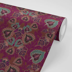 Garden of India wallpaper by Tatie Lou in burgundy, partly unrolled roll showing an Indian-style garden medallion